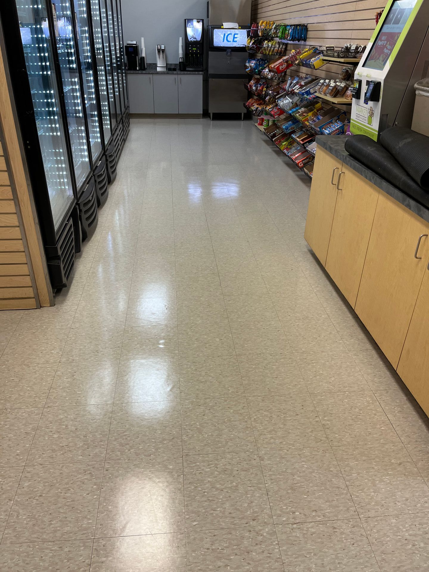 The floor of a convenience store is very clean and shiny.