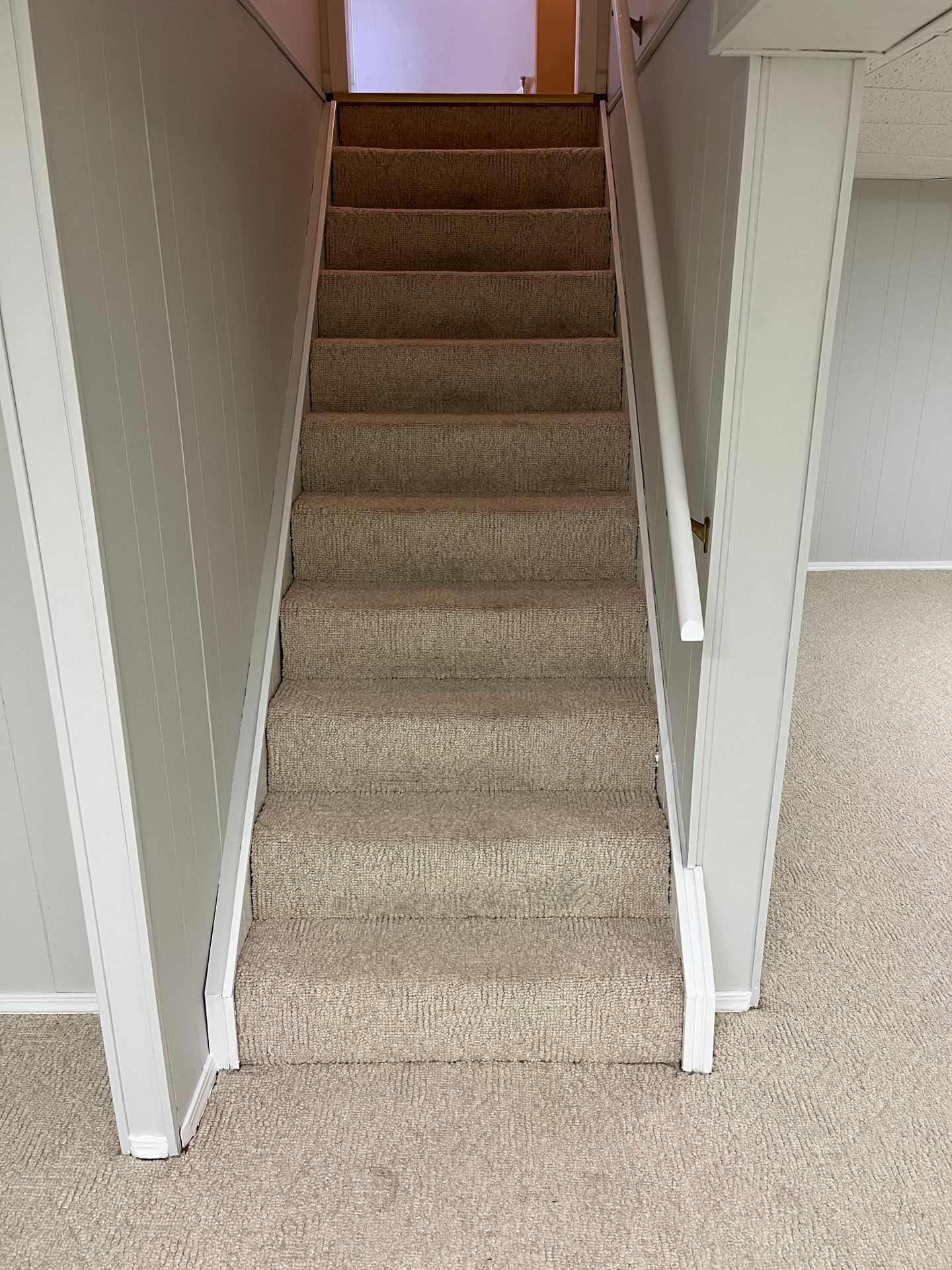 A set of stairs leading up to the second floor of a house.