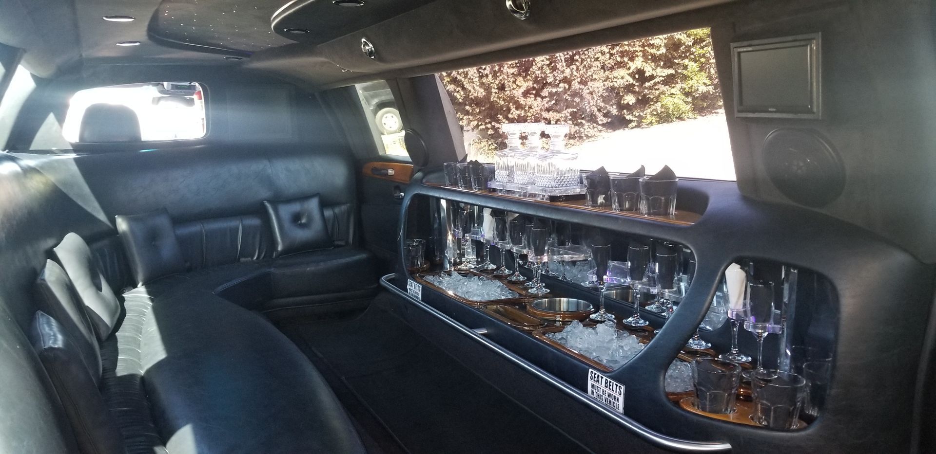 The inside of a limousine with a bar in the back