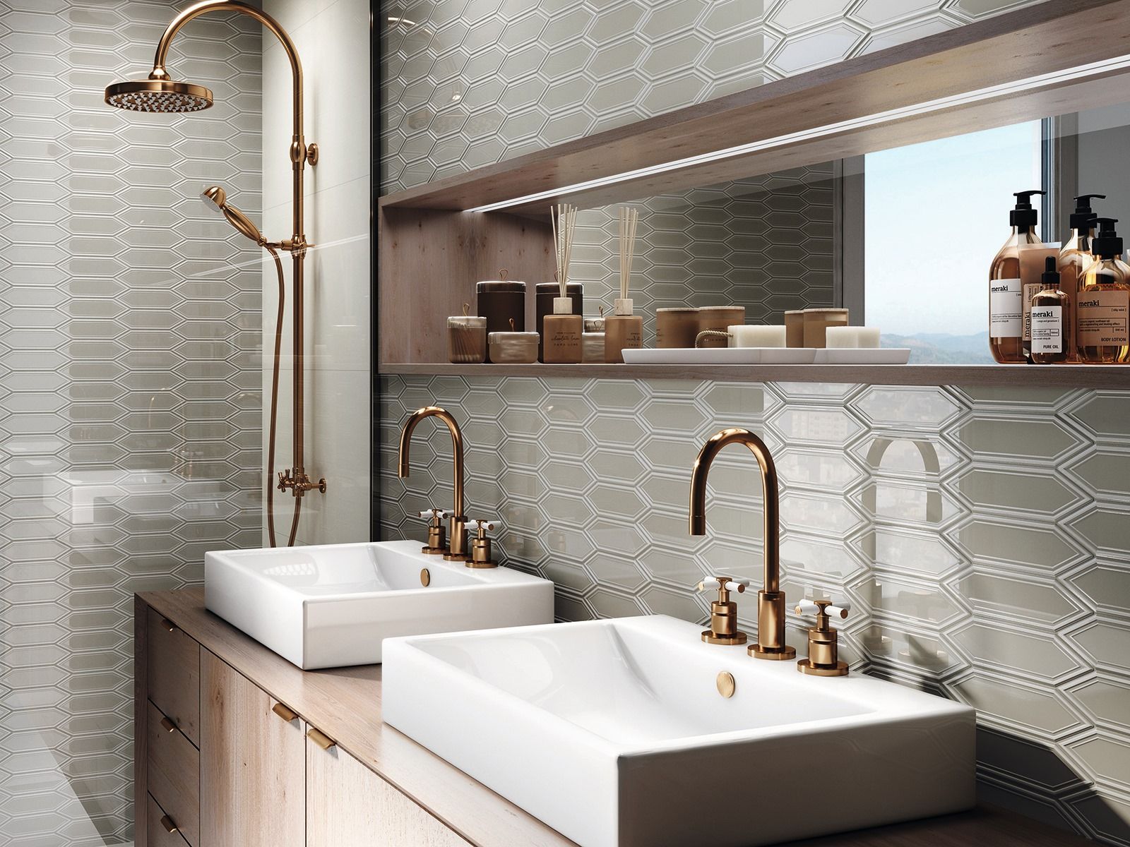 Bathroom with gold fixtures, two sinks, shower, and patterned gray tile. Wooden shelf with toiletries.