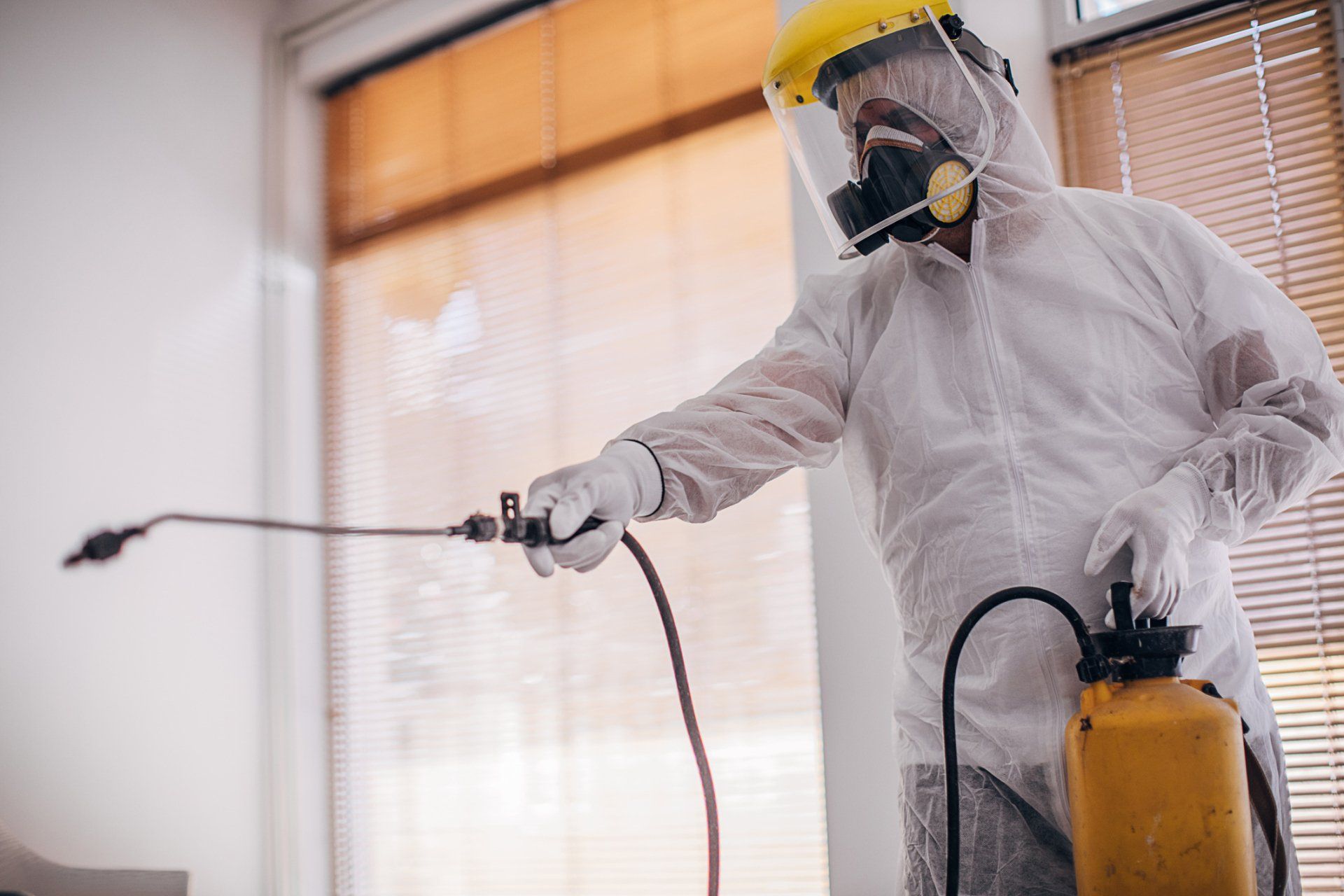 Man Spraying Pesticide — Forrest City, AR — Ray Houser’s Termite & Pest Control