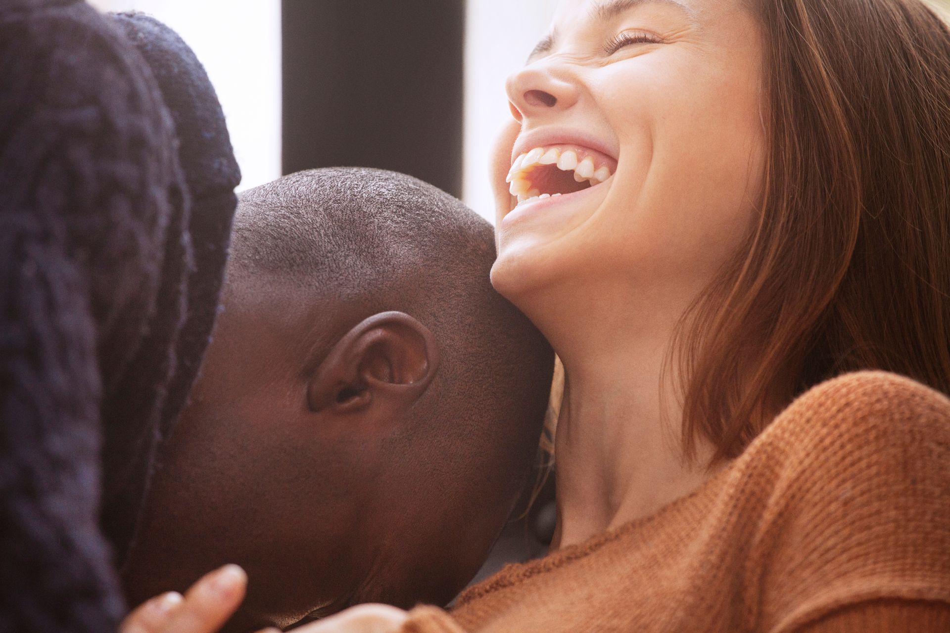 View of couple laughing.