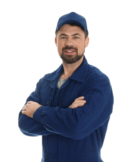 A man in a blue jacket and hat is standing with his arms crossed