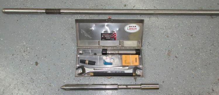 a stainless steel toolbox filled with tools and a stainless steel rod .