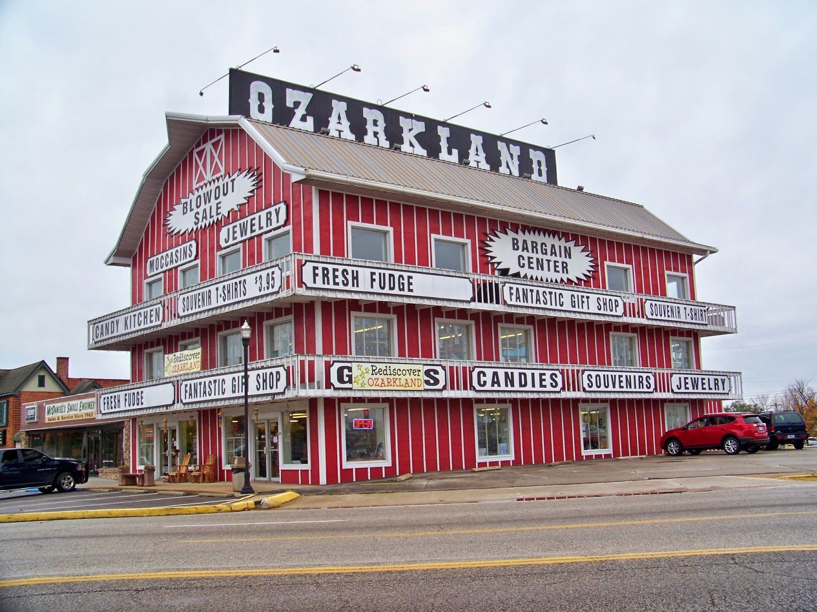 A large red building with a sign that says ozarkland