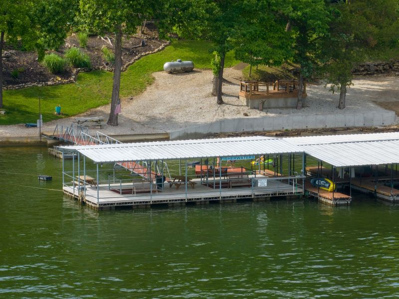 An aerial view of a dock on a lake