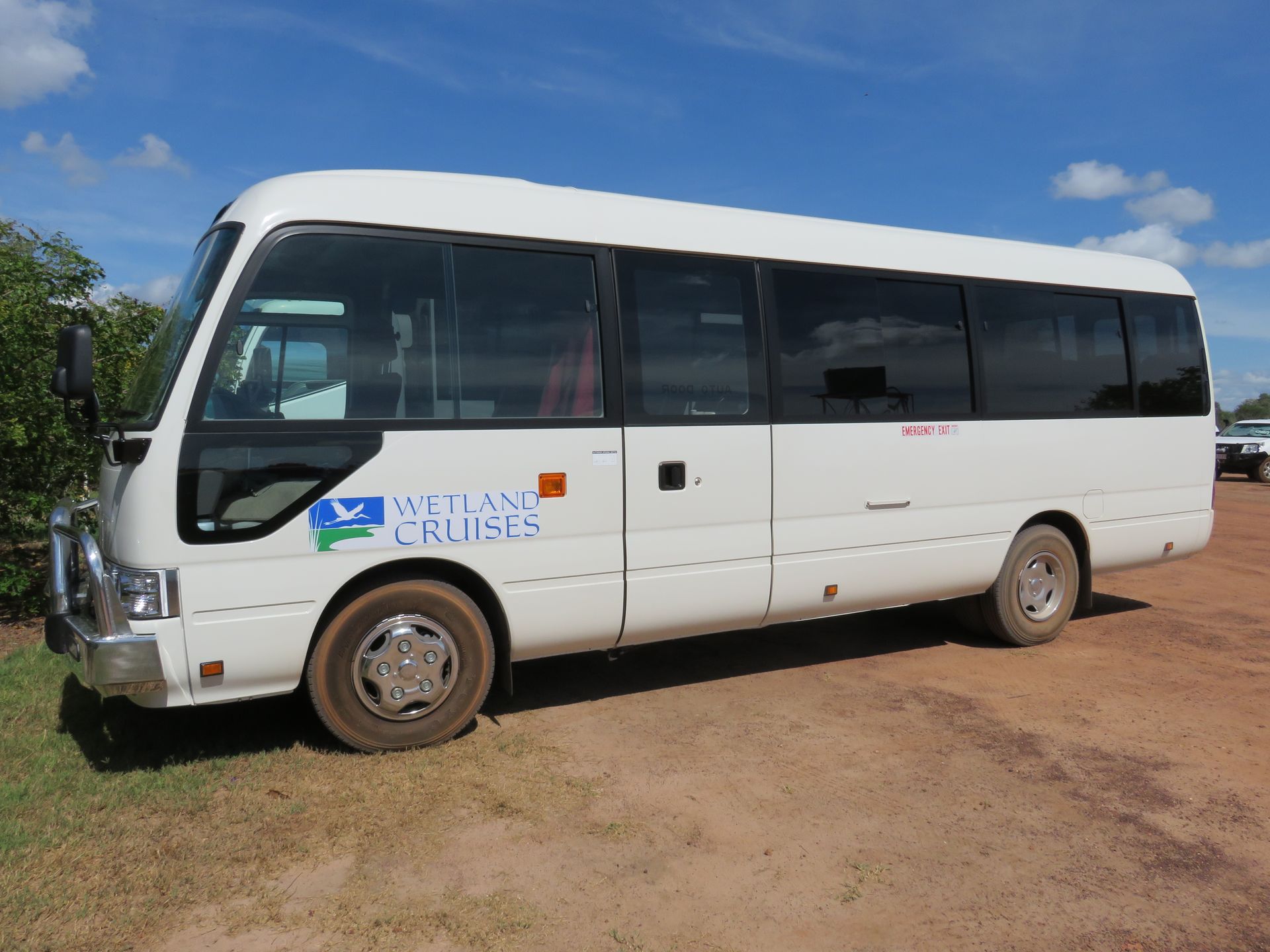 A white bus with the words african cruises on the side