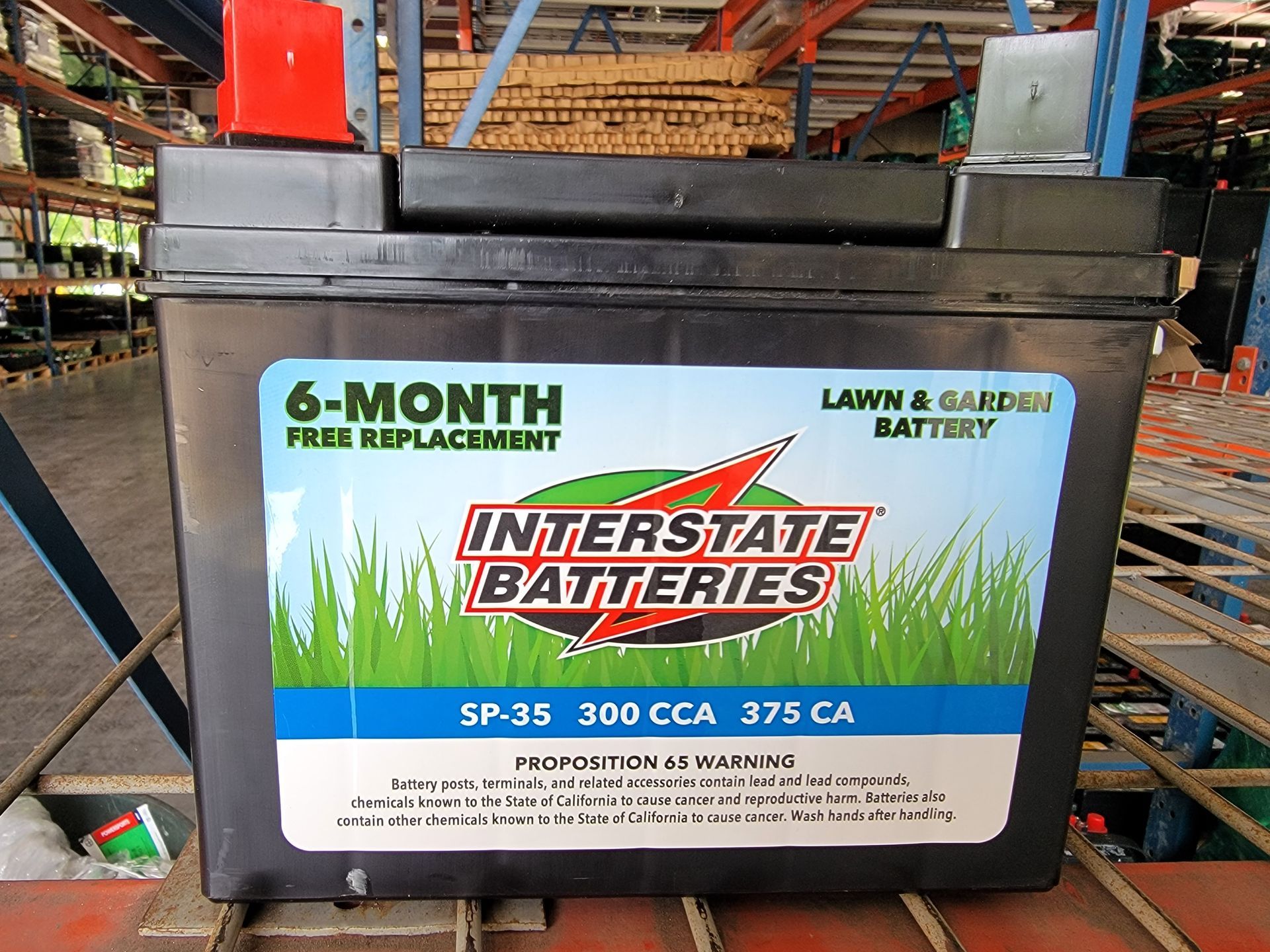 Black Interstate lawn and garden battery with a 6-month free replacement guarantee.