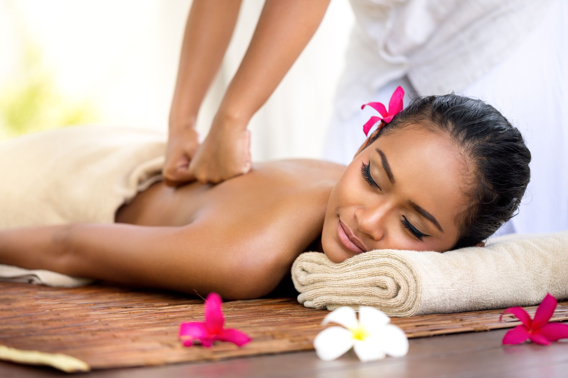 A woman is getting a massage at a spa.