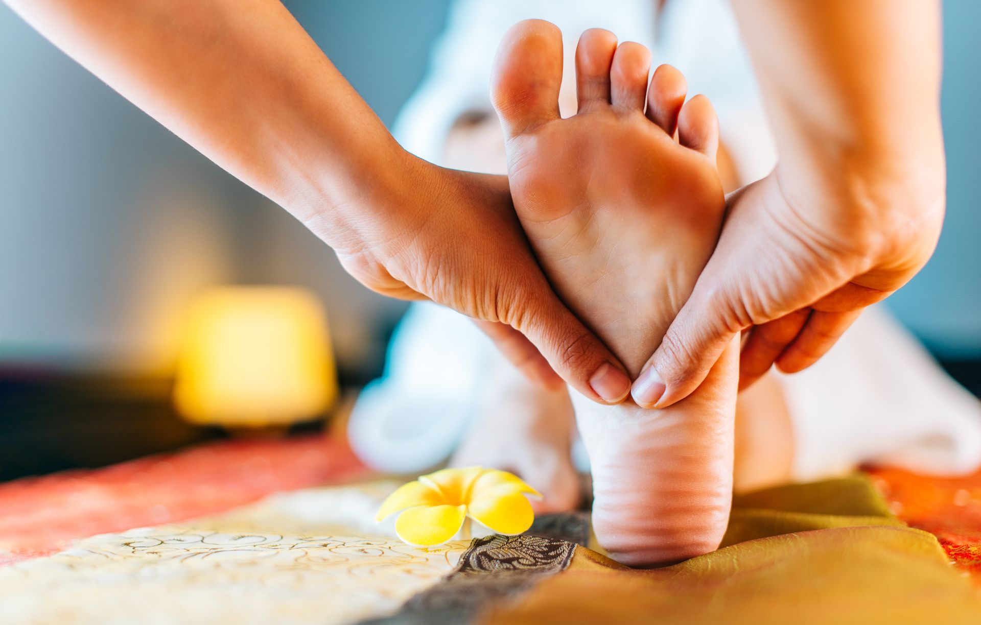 A woman is getting a foot massage at a spa.