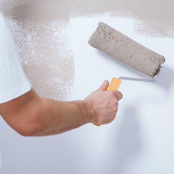 Handyman Painting Wall White — Building Maintenance in Bundaberg, QLD
