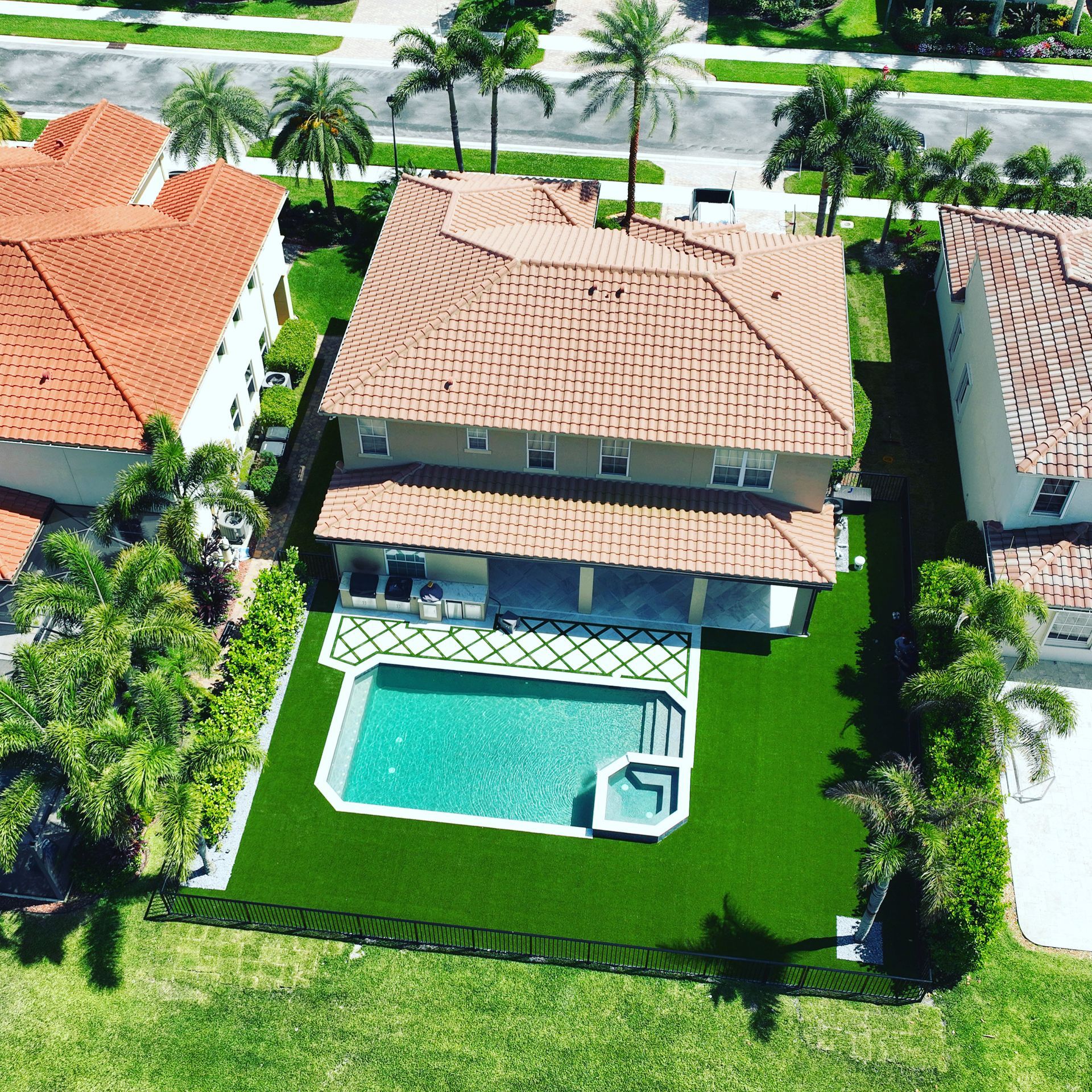 An aerial view of a house with a swimming pool