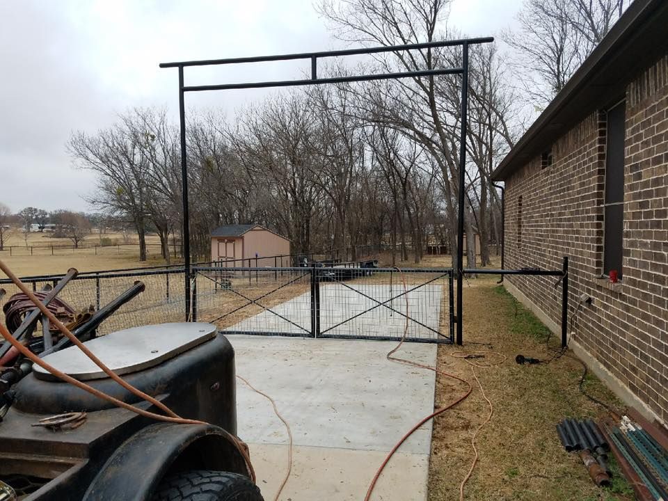A trailer is parked in front of a brick building