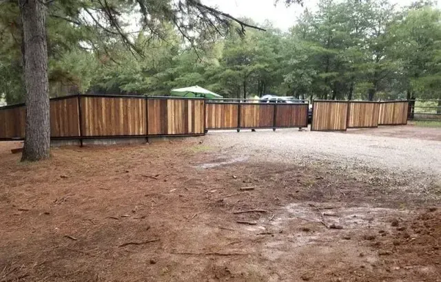 A trailer is parked in front of a brick building