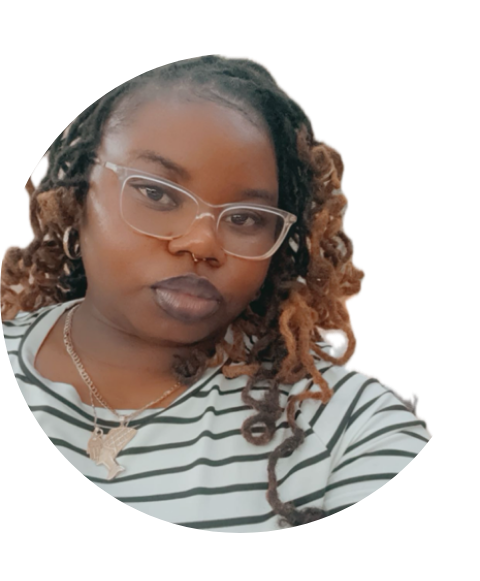 Woman wearing glasses, striped shirt, and locs with ombre highlights.