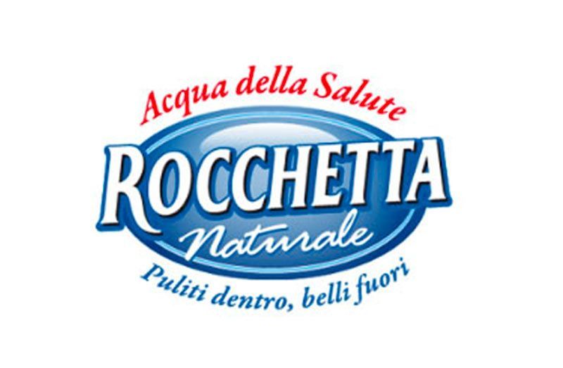 Logo for Rocchetta water, featuring blue and white oval with 