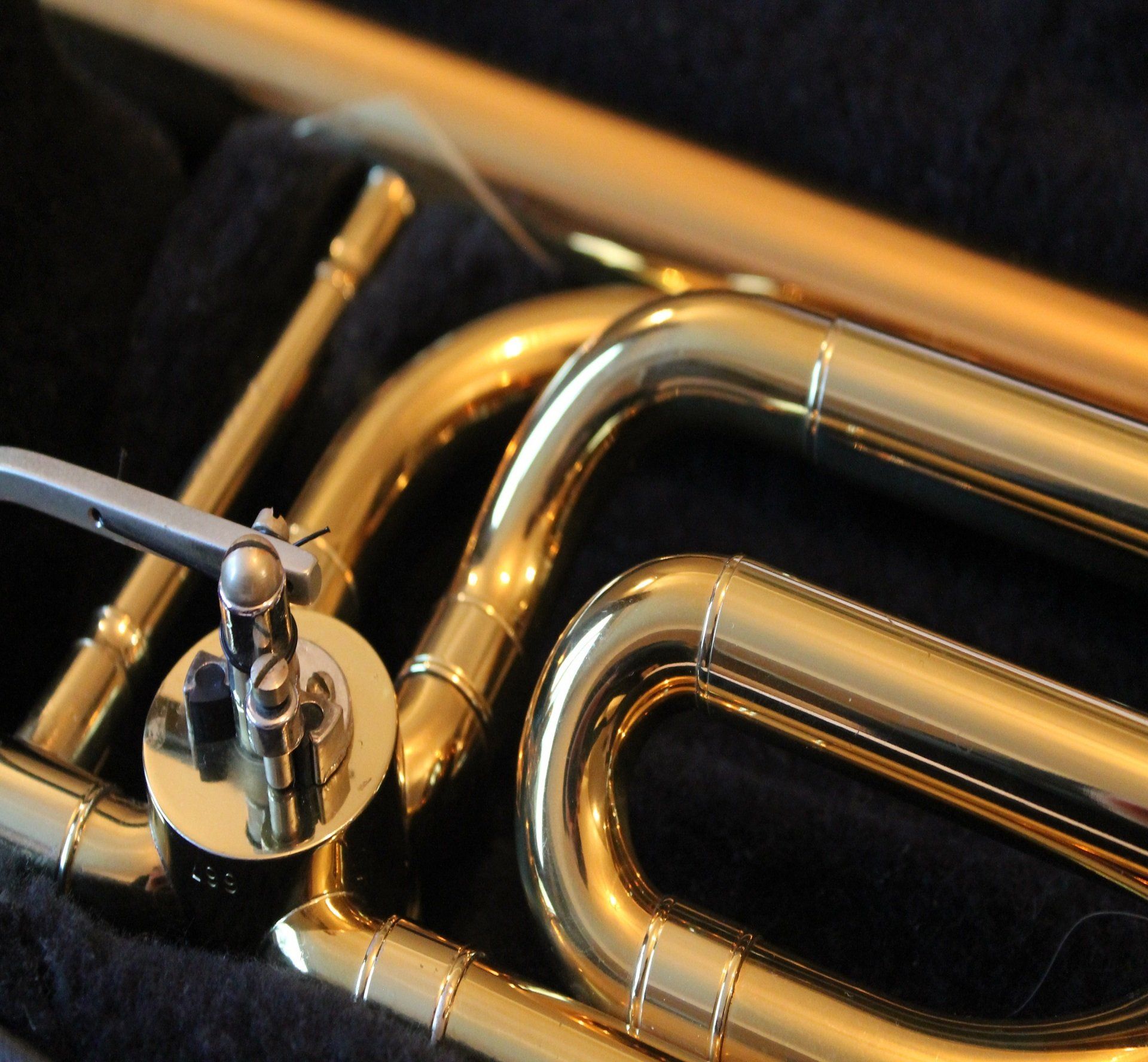 A close up of a trombone in a case
