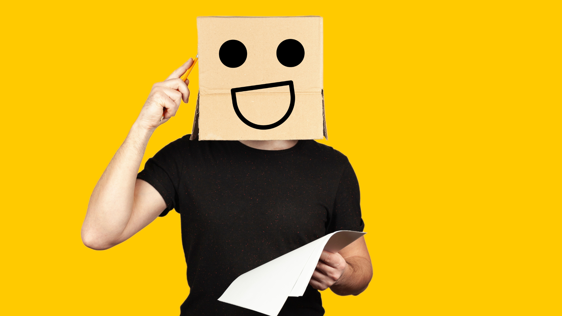 erson with a cardboard box with a smiling face as a head, holding a piece of paper and pointing to t