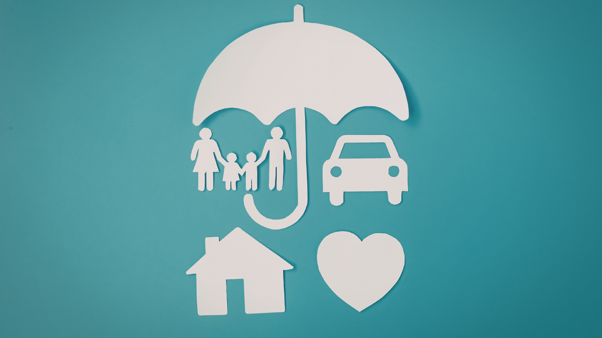 Paper cutout icons of a family, car, house, and heart under an umbrella, symbolizing protection and coverage, on a blue background.