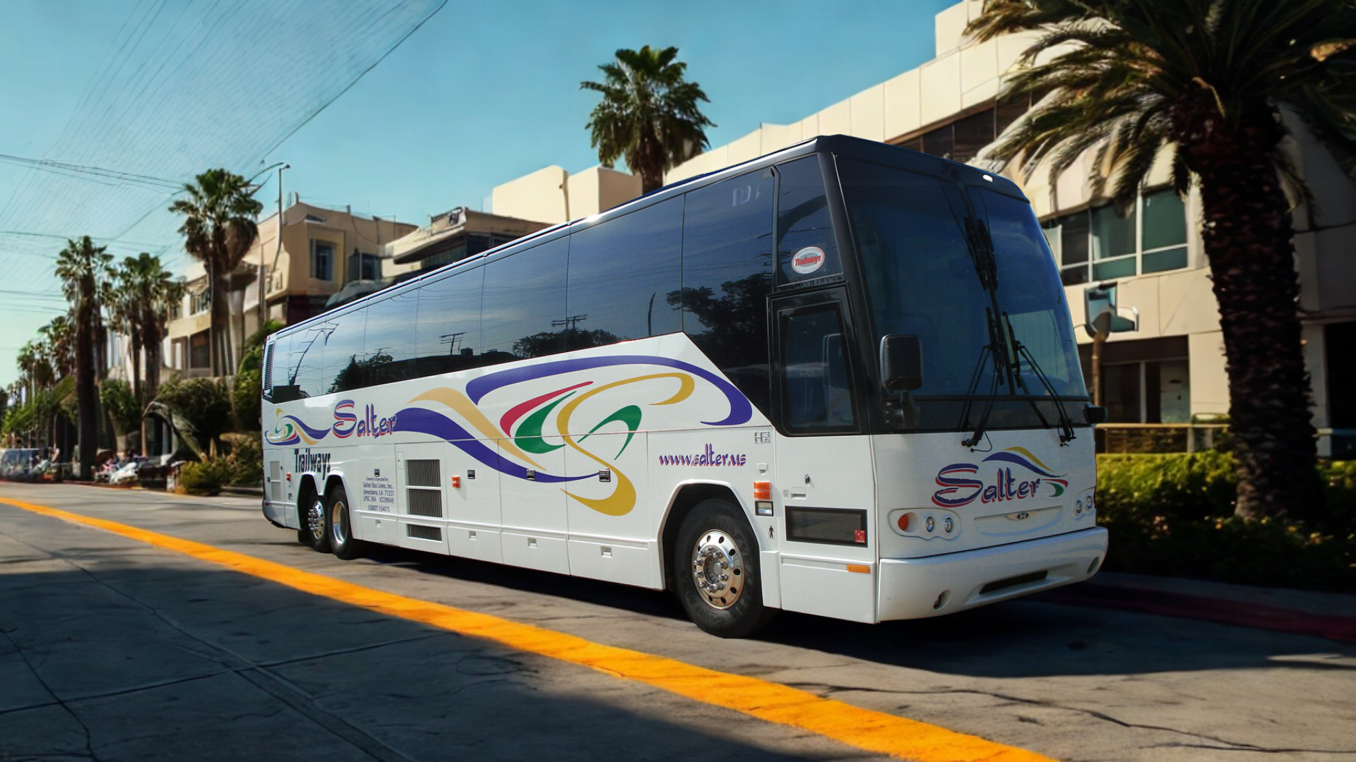 An airplane is flying over an airport terminal.