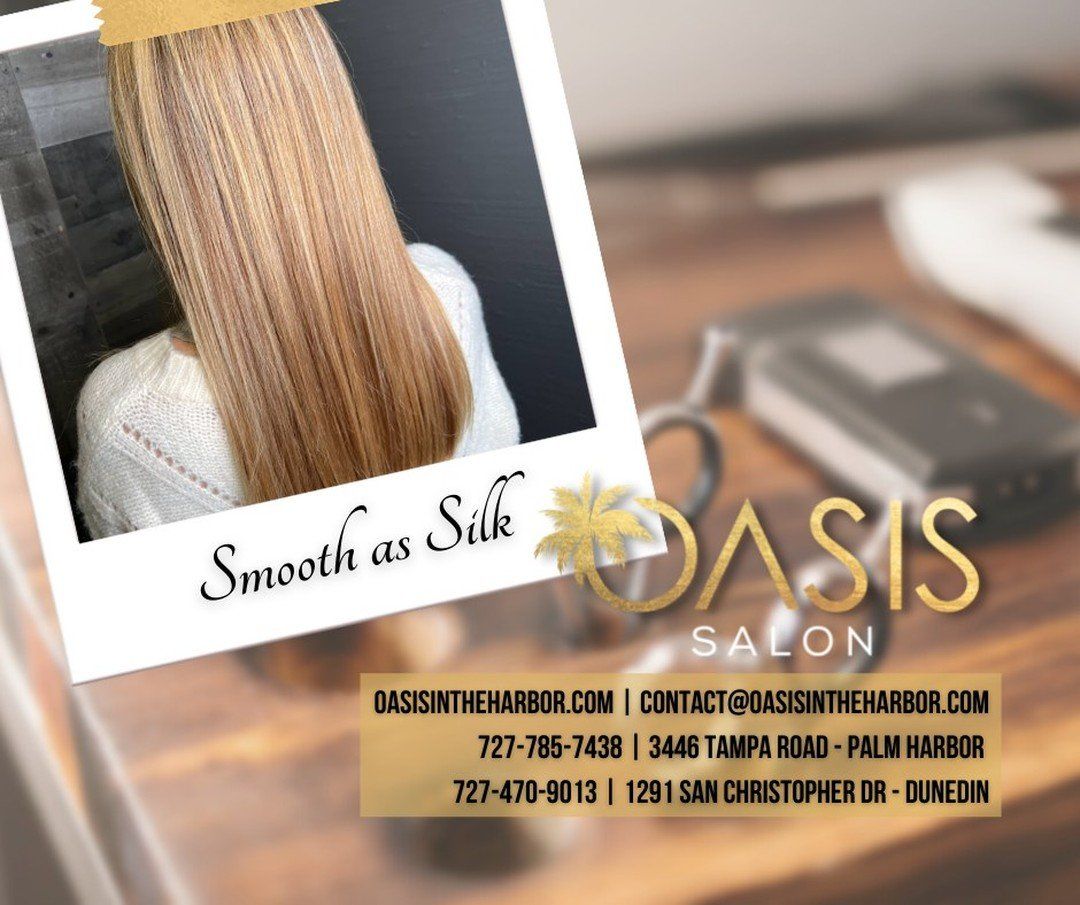 An advertisement for oasis salon with a picture of a woman 's hair