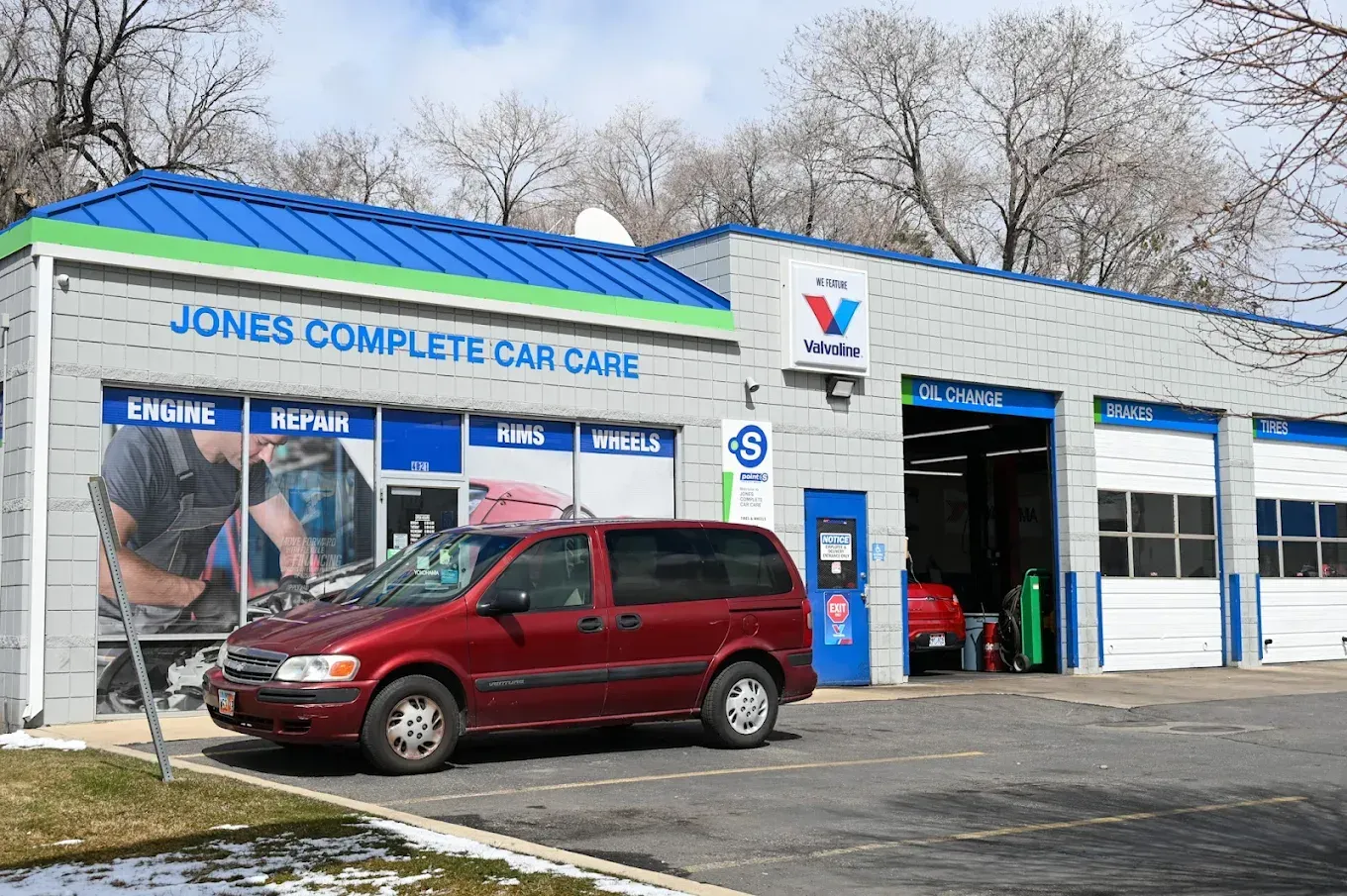 Jones Complete Care Care auto service building with red SUV parked outside | Jones Complete Car Care