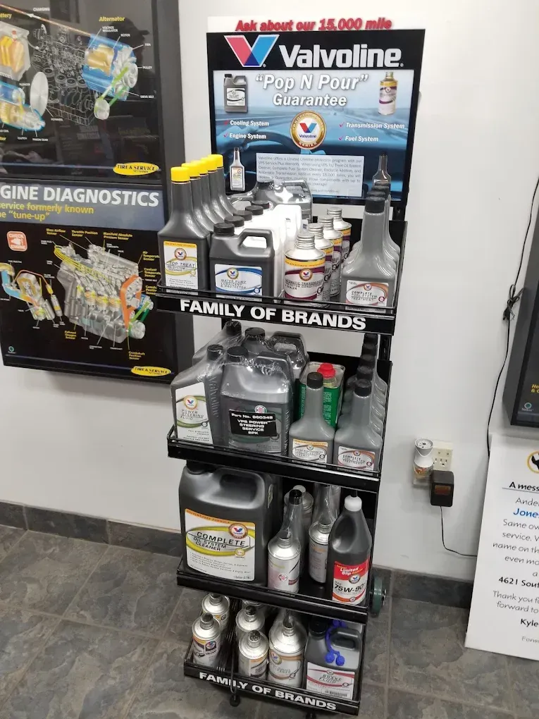 Valvoline motor oil display on retail shelf with assorted car fluids and automotive products | Jones Complete Car Care