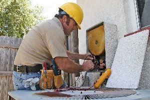 Man Repairing Air Conditioning Unit — Vashon, WA — Vashon Heating & Cooling