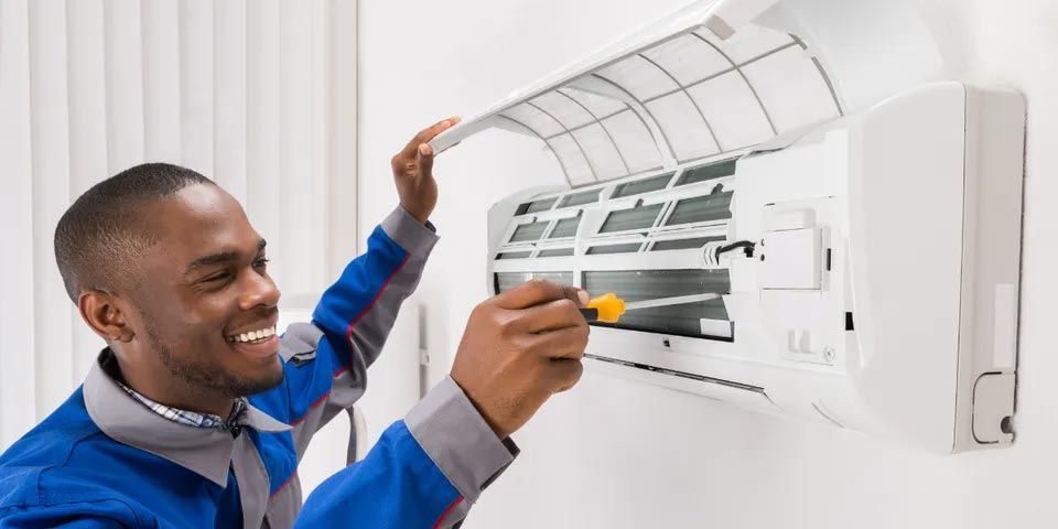 Technician Repairing Air Conditioner — Vashon, WA — Vashon Heating & Cooling