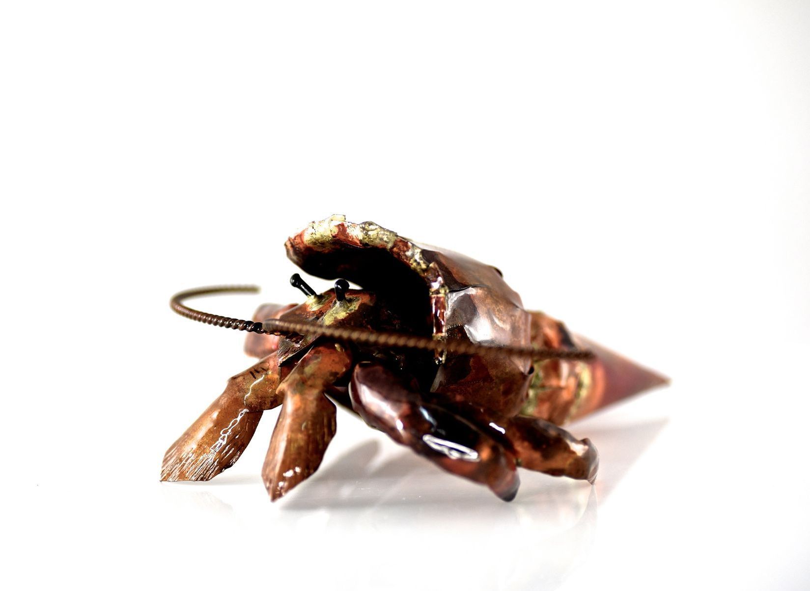 Shane bower sculpture of a hermit crab in copper
