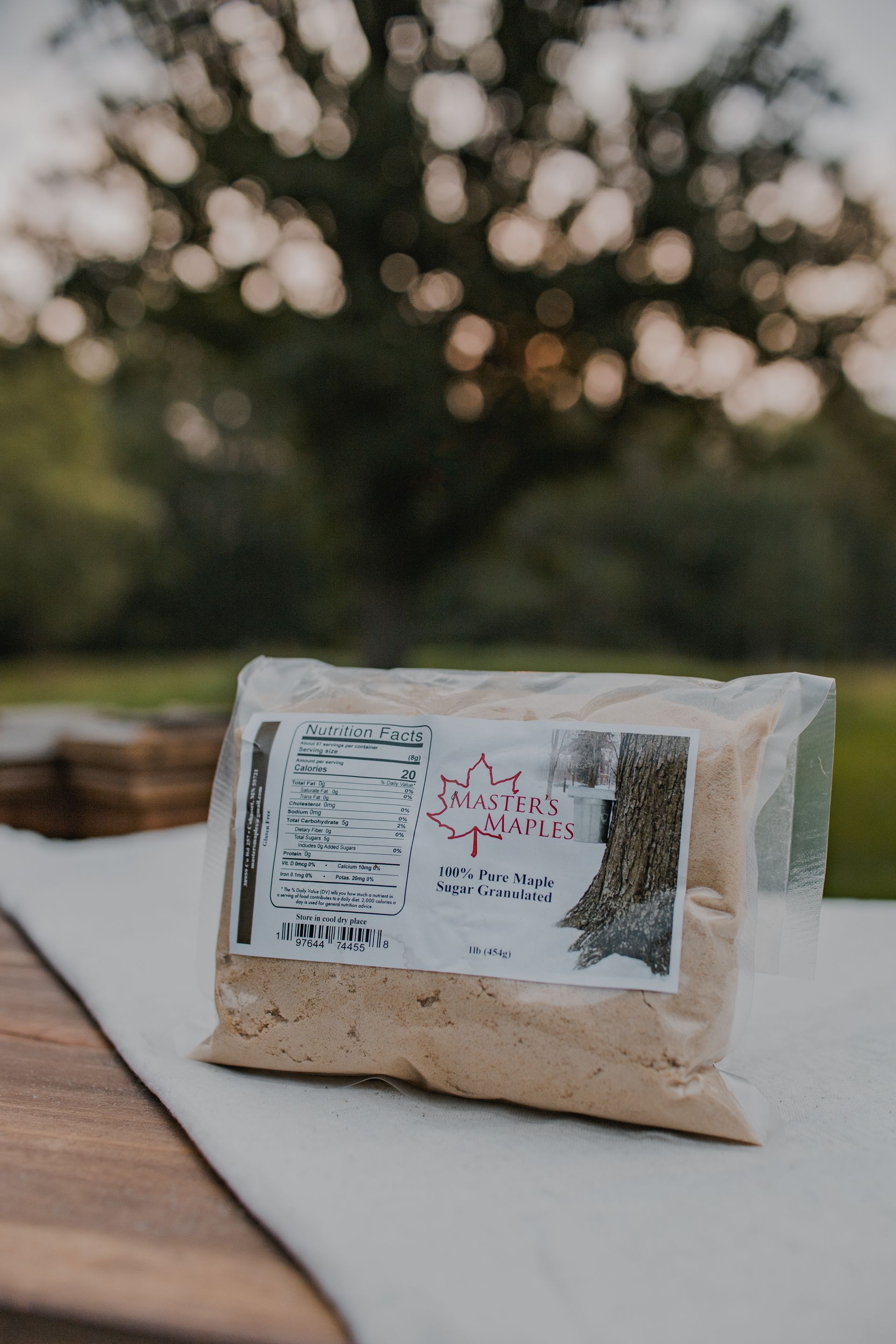 A maple leaf made out of sand on a white background