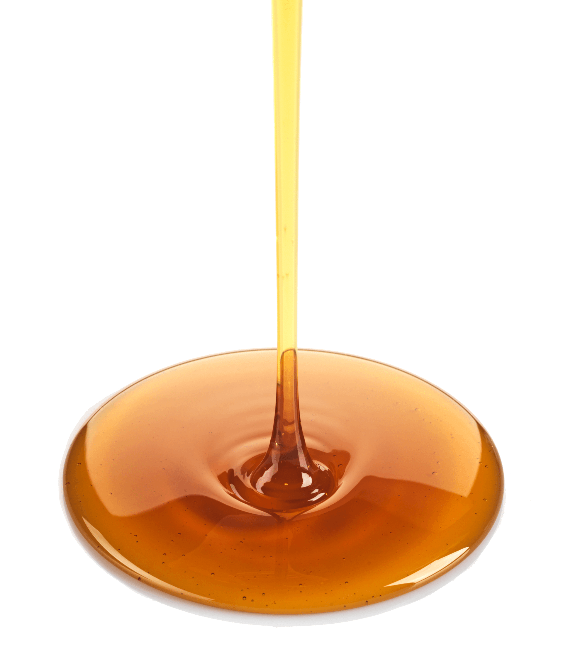 Syrup is being poured on a white surface