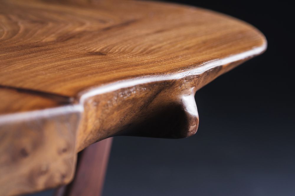 A Close Up Of A Wooden Table With A Black Background - Arborist Magnetic Island, QLD