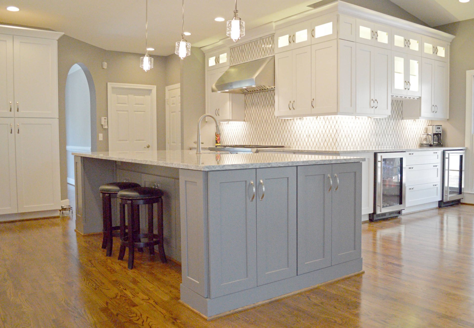 There is a large island in the middle of the kitchen.