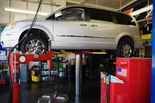 Minivan on a lift - Auto Repair and Maintenance in Lakewood, Colorado