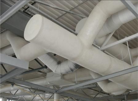 White, insulated ventilation ducts branching across a metal-framed ceiling.