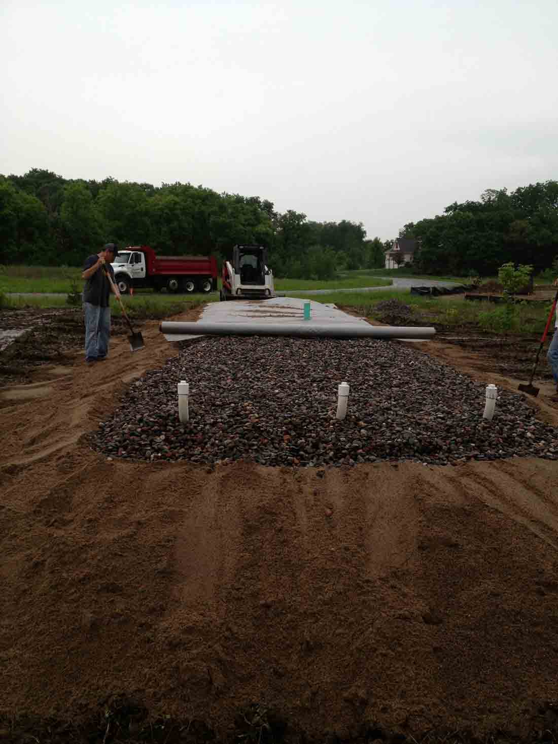 Man holding the shovel — Cedar, MN — Casper's Excavating