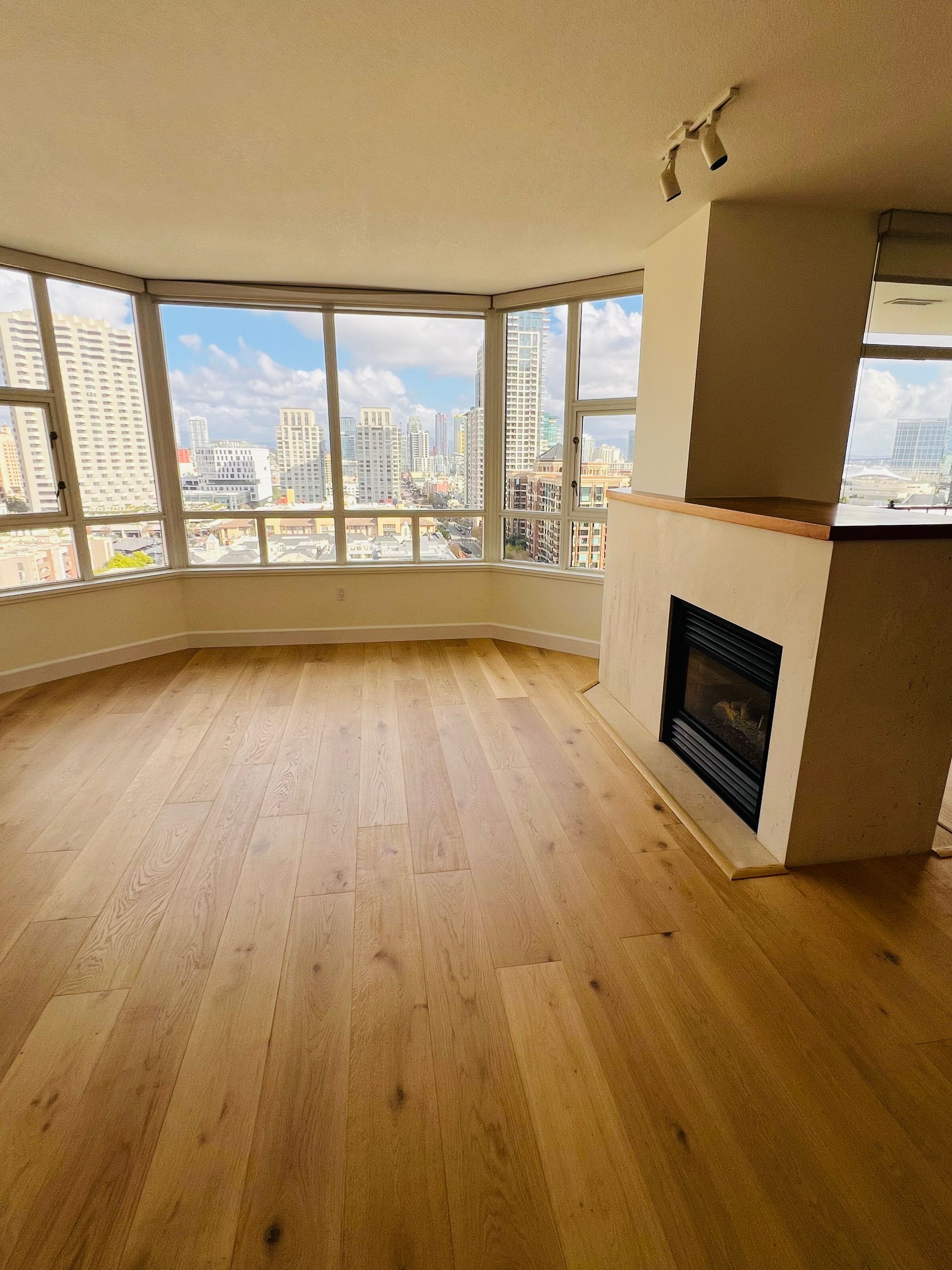 A living room with engineered hardwood floors and a fireplace in escondido ca