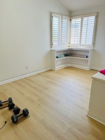 laminate floor and dumbbells on the floor in oceanside ca