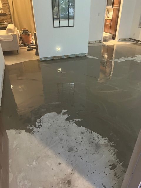 A room with a lot of concrete on the floor