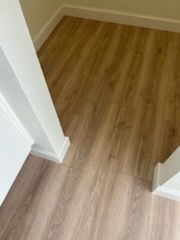 Floor samples and baseboard repairs in Carlsbad homes.