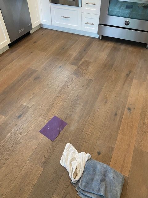 A kitchen floor with a purple square on it