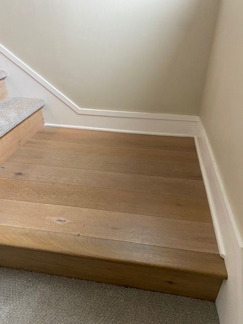 Flooring fitting and baseboard replacements in Mira Mesa.