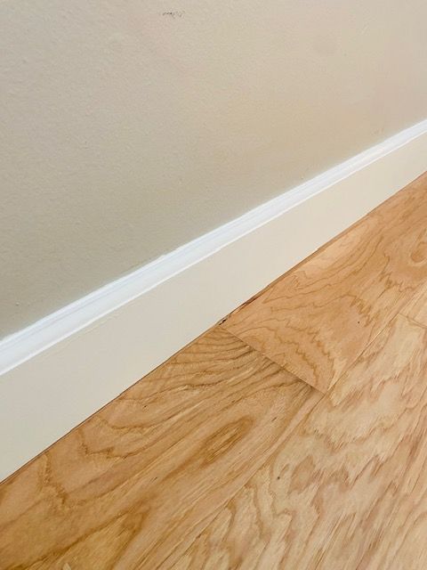Flooring installation with baseboard repairs in Encinitas.