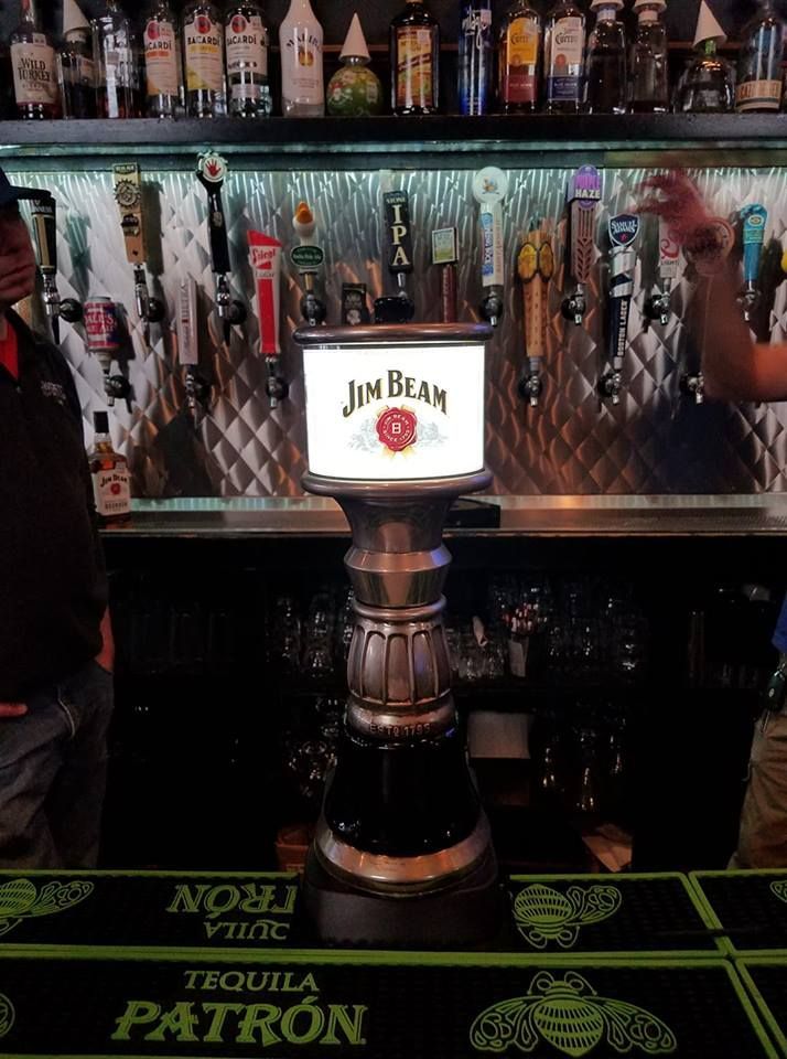 A bar with a jim beam sign on it