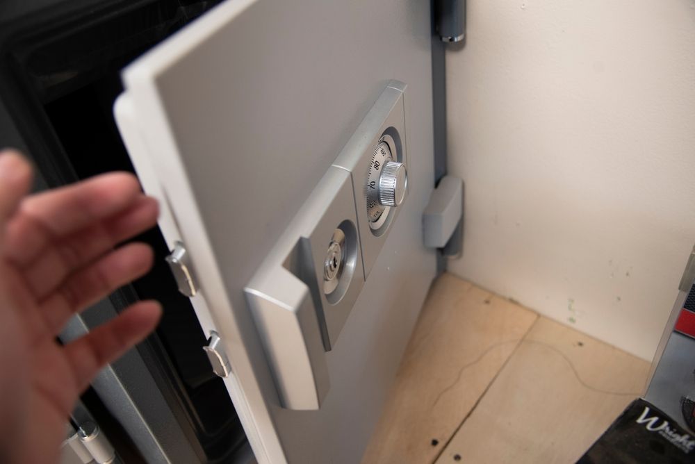 Open vault door with metal handle and spinning combination dials — Terrace Locksmiths in Raymond Terrace, NSW