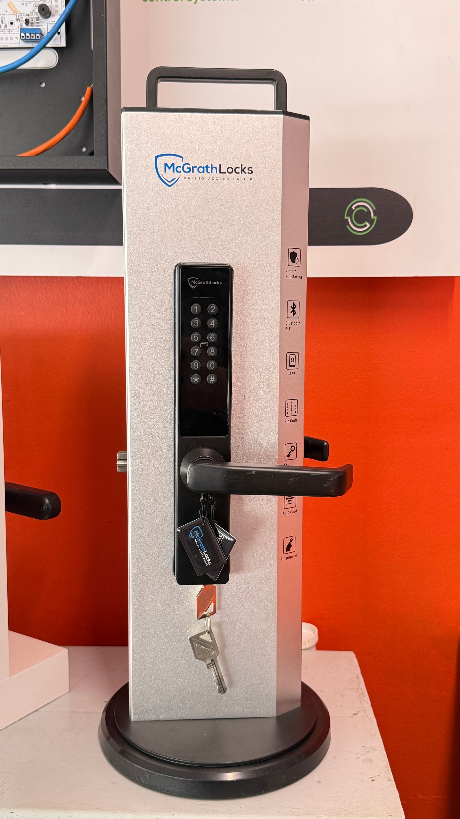 Keys Hanging from A Lock on A White Door Handle with A Wooden Cabine — Terrace Locksmiths in Raymond Terrace, NSW