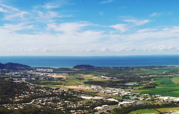 An Aerial View Of A City And The Ocean From A Mountain — FNQ Smoke Alarms & Maintenance In Smithfield, QLD
