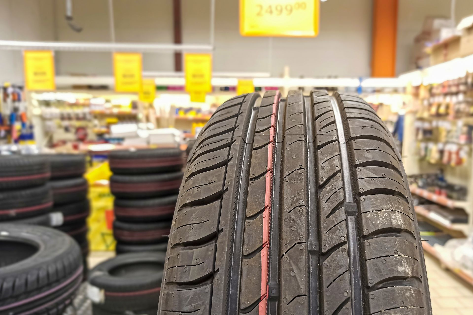 Close-up of a car’s tire inside a car parts store.