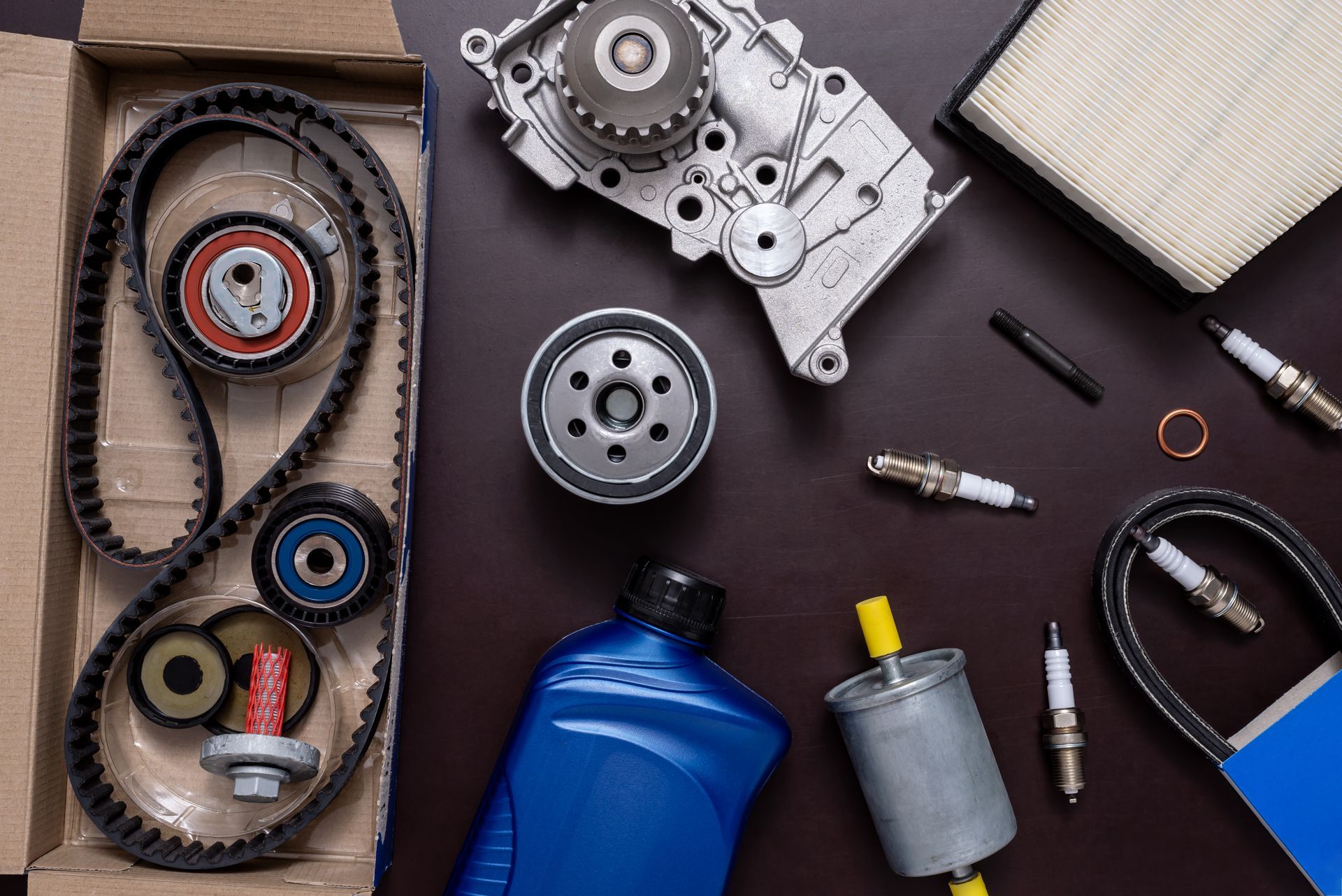 Auto parts assortment including timing belt kit and engine components